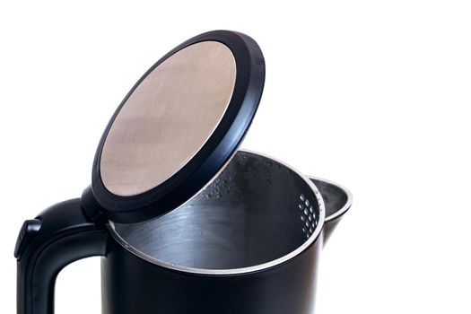 Black open electric kettle close up, isolated on white background