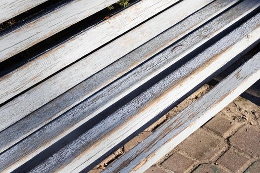 The icy boards of the benches in the Park close up