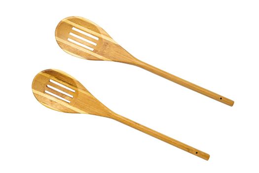 Two wooden spoons , kitchen accessories on white background isolated. High quality photo top view
