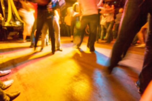 People dancing at the party abstract blur background with bokeh