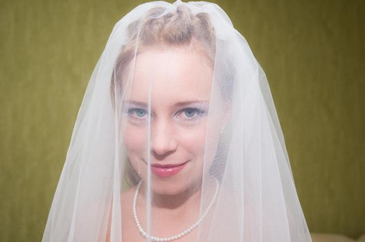 Happy Young bride posing before wedding ceremony