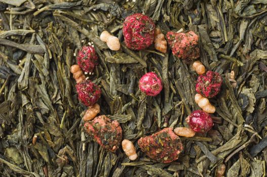 Heap of dry chinese green tea - background texture. Macro shot