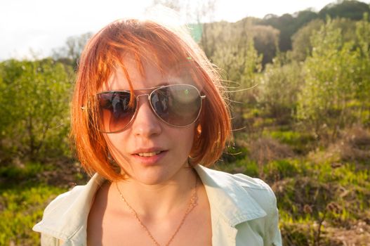 Portrait of beautiful summer girl outdoor in park