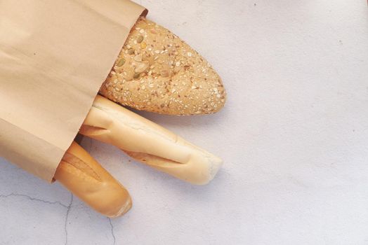detail shot of whole grain baked bread on table .