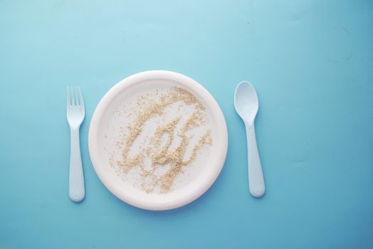 Empty plate after eating on table ,