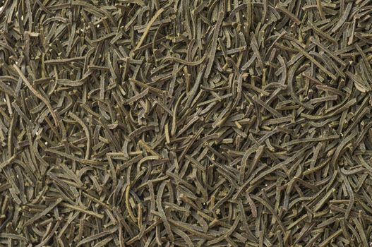 Heap of dry chinese green tea - background texture. Macro shot