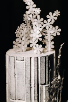 Amazing Cakes. chocolate wedding cake white Cake on a black background.Large cake in white chocolate.