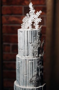 Amazing Cakes. chocolate wedding cake white Cake on a black background.Large cake in white chocolate.