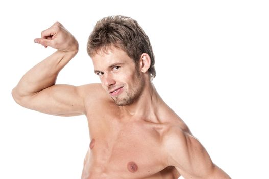 Healthy young man showing his biceps isolated on white