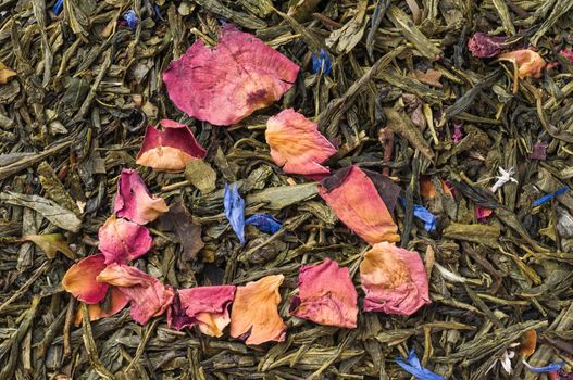 Heap of dry chinese green tea - background texture. Macro shot