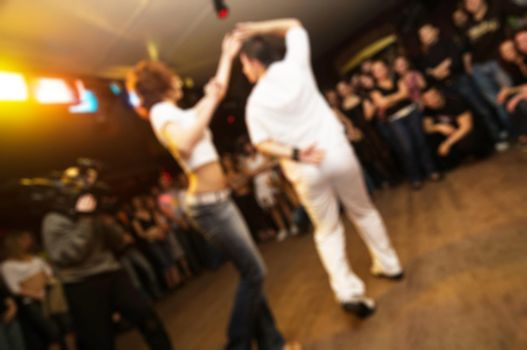 People dancing at the party abstract blur background with bokeh