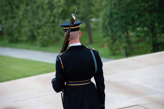 Ceremony at the Tomb of the Unknown soldier in Arlington, VA cadet from the back