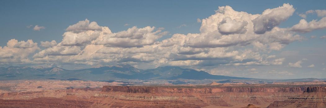 Panorama of Canyonlands landscape in Utah with gorgeous puffy cloudscape