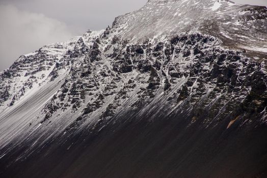 Close up snow capped mountain ridge black and white Icelandic texture heavenly awe inspiring wow breathtaking