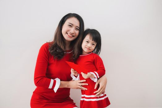 Vietnamese mother and daughter celebrate new year at home. Tet Holiday.