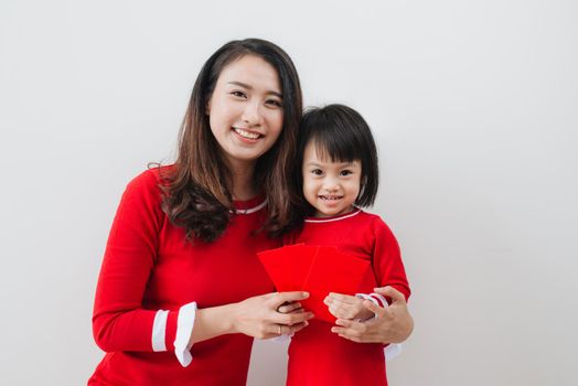 Vietnamese mother and daughter celebrate new year at home. Tet Holiday.