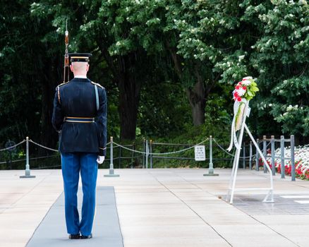 Ceremony at the Tomb of the Unknown soldier in Arlington, VA cadet from. the back