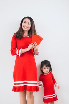 Vietnamese mother and daughter celebrate new year at home. Tet Holiday.