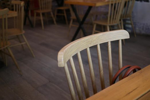 many empty chair at cafe during corona virus period .