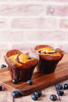 blueberry muffins on table with copy space .