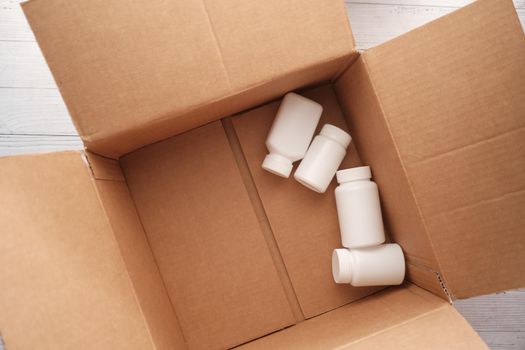 medical pill containers in open a box ,
