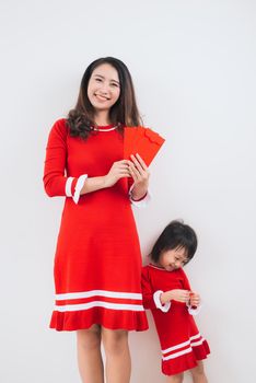 Vietnamese mother and daughter celebrate new year at home. Tet Holiday.