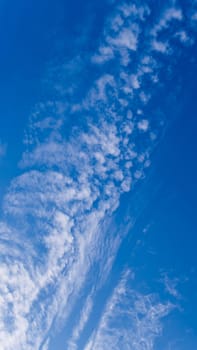 Fluffy clouds in the bright blue sky