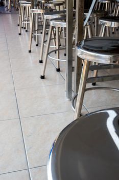 Shiny Stainless steel stool in the canteen of school