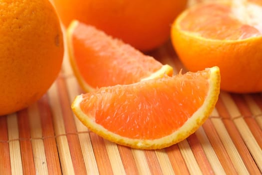 close up of slice of orange fruit in a bowl .