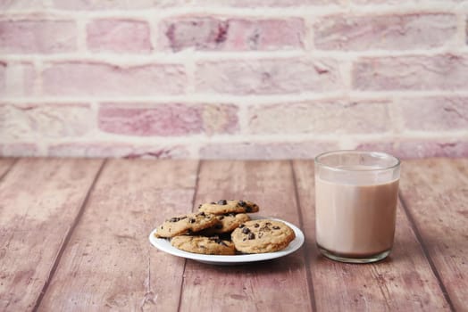 chocolate cooking and a glass of chocolate milkshake on table ,