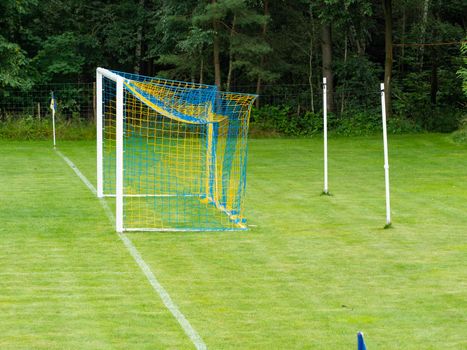 Training soccer field with green turf. Football field with goals and markings or side lines