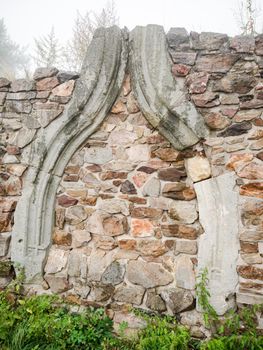Stony wall of fortress made from broken rocks. Old stony wall in England