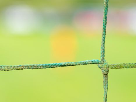 Close-up Knot of Blue Net Around Small Soccer Field with Selective Focus