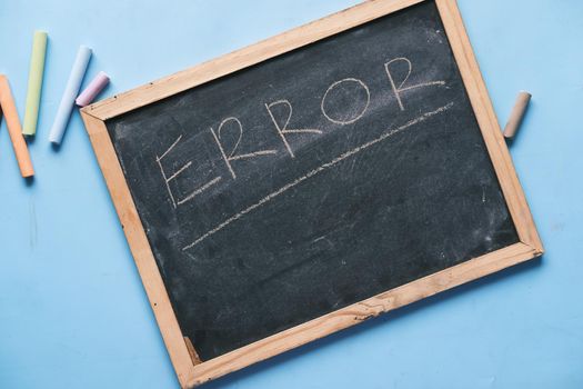 error word on a chopping board on table,