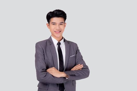 Portrait businessman in suit with crossed his arms standing isolated on white background, young asian business man is manager or executive having confident is positive with success.