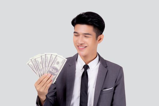 Young asian business man holding money dollar isolated on white background, businessman in suit holding banknote and success and excited with finance, savings and investment, income and spending.