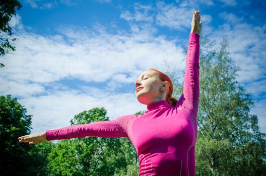 Athlete woman fitness excercising and stretching in a park