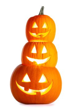 Stack of glowing Halloween Pumpkins isolated on white background