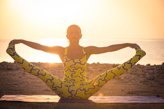 Yoga practice. Woman doing asana at sunrise