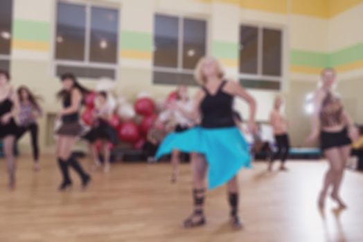 Dance class for women at fitness centre abstract blur background