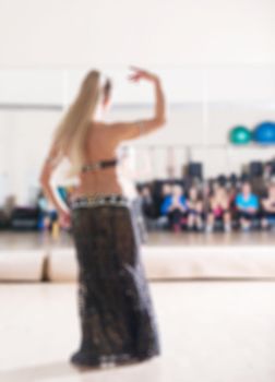 Dance class for women at fitness centre abstract blur background
