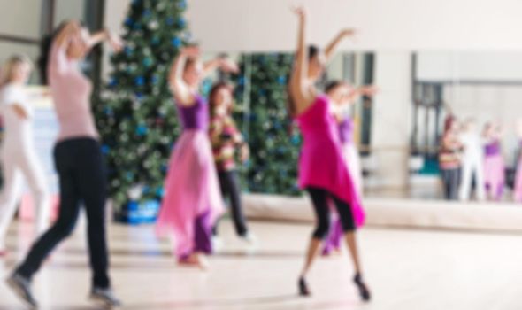 Dance class for women at fitness centre abstract blur background