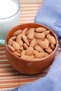 almond nut and milk on table top down.