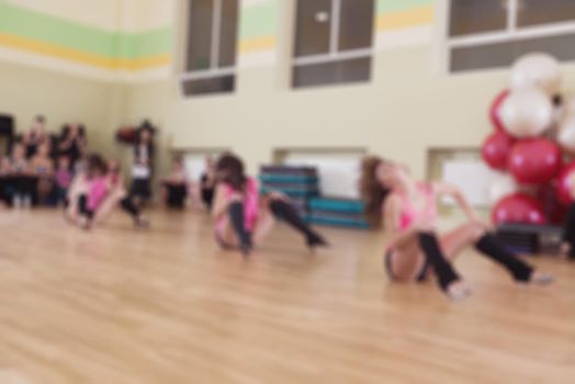 Dance class for women at fitness centre abstract blur background