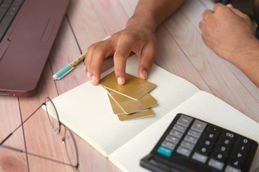 close up of person hand holding credit card.