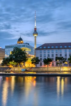 The river Spree in downtown Berlin with the famous TV Tower before sunrise