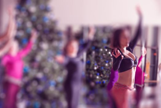 Dance class for women at fitness centre blur background