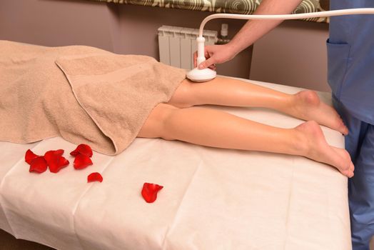 Woman gets therapy treatment at spa salon