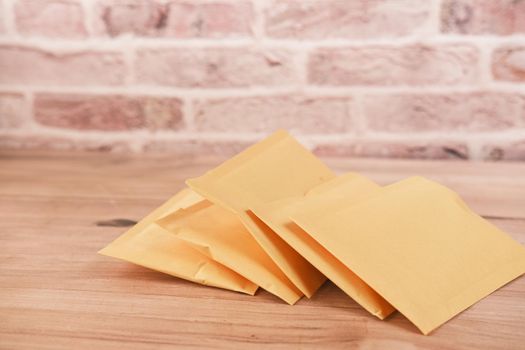 yellow paper bubble envelope on table ,