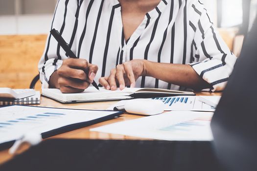 Business woman working to analyze technical price graph and indicator.